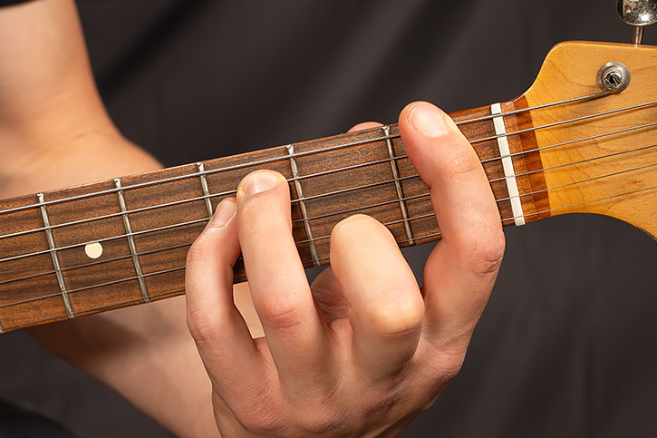 AL playing and three-string power chords